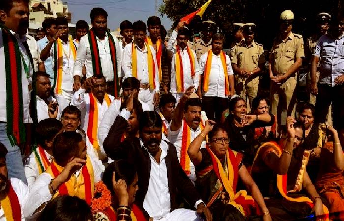 Pro Kannada agitators break nameplates of businesses and companies in their rally on Wednesday