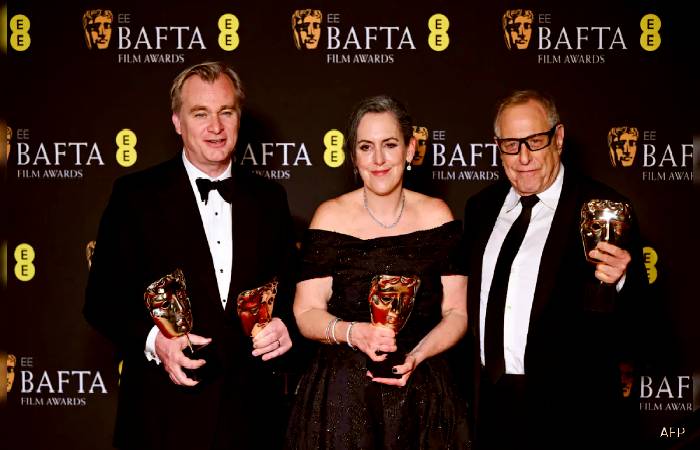 Crew of Oppenheimer with the BAFTA trophies