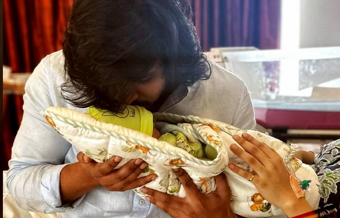 Nikhil and his wife with their new born